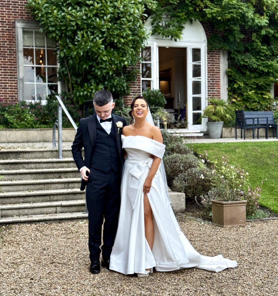 A smiling bride and groom